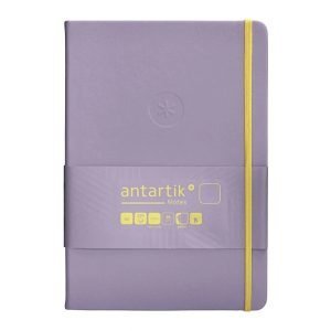 CUADERNO TAPA BLANDA ANTARTIK A5 HOJAS LISAS MORADO Y AMARILLO